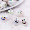 top view of a pile of 16mm Pumpkin Face on White AB Bubblegum Beads