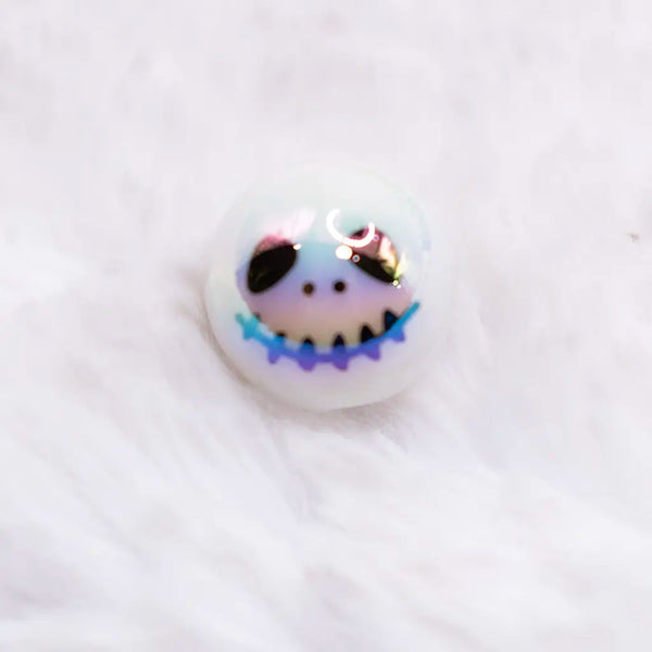macro view of a pile of 16mm Skeleton Face on White AB Bubblegum Beads