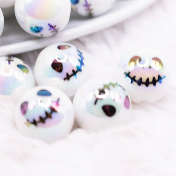 close up view of a pile of 16mm Skeleton Face on White AB Bubblegum Beads
