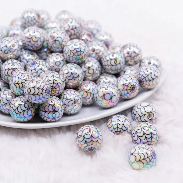 front view of a pile of 16mm White with Black Spiderweb AB Bubblegum Beads