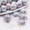 macro view of a pile of 16mm White with Black Spiderweb AB Bubblegum Beads