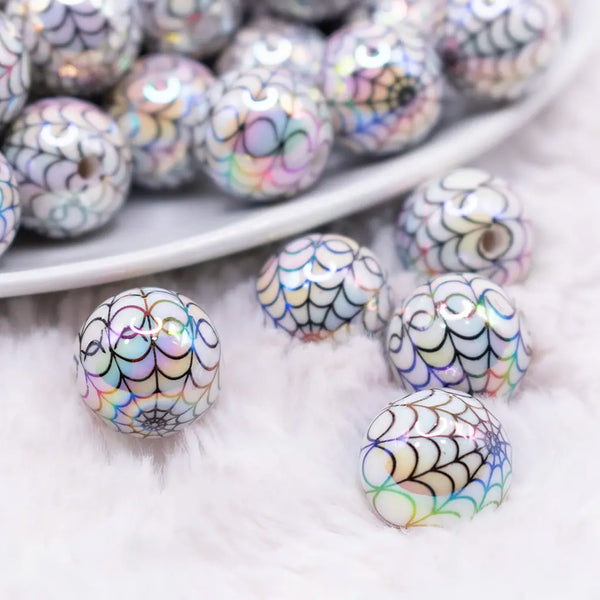 macro view of a pile of 16mm White with Black Spiderweb AB Bubblegum Beads