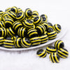 front view of a pile of 16mm Black and Yellow Stripe Bubblegum Beads