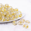front view of a pile of 16mm Yellow Flaked Flower Bubblegum Bead