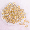 top view of a pile of 16mm Yellow Flaked Flower Bubblegum Bead