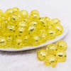 front view of a pile of 16mm Yellow Foil Bubblegum Beads