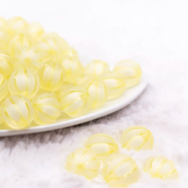 front view of a pile of 16mm Yellow Frosted Pumpkin Shaped Bubblegum Bead