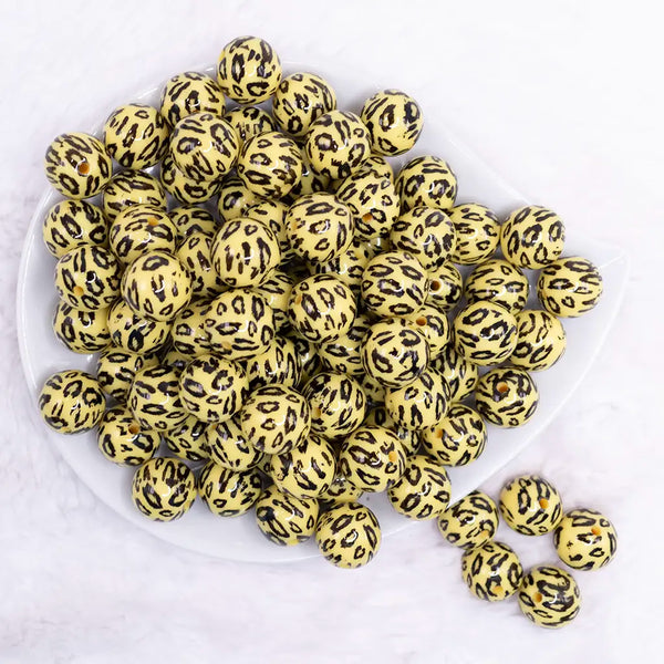 top view of a pile of 16mm Yellow Leopard Print Acrylic Bubblegum Jewelry Beads