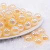 front view of a pile of 16mm Yellow Opalescence Bubblegum Bead