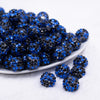 front view of a pile of 16mm Black and Blue Confetti Rhinestone AB Bubblegum Beads