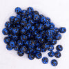 top view of a pile of 16mm Black and Blue Confetti Rhinestone AB Bubblegum Beads