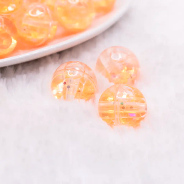 macro view of a pile of 18mm Orange Glitter Acrylic Water Beads