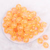 top view of a pile of 18mm Orange Glitter Acrylic Water Beads