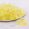 front view of a pile of 18mm Yellow Glitter Acrylic Water Beads