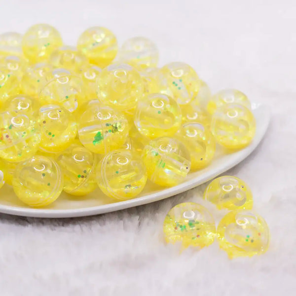 front view of a pile of 18mm Yellow Glitter Acrylic Water Beads