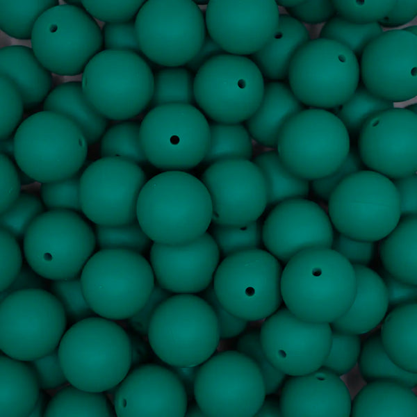top view of a pile of. 19mm Deep Green Round Silicone Bead