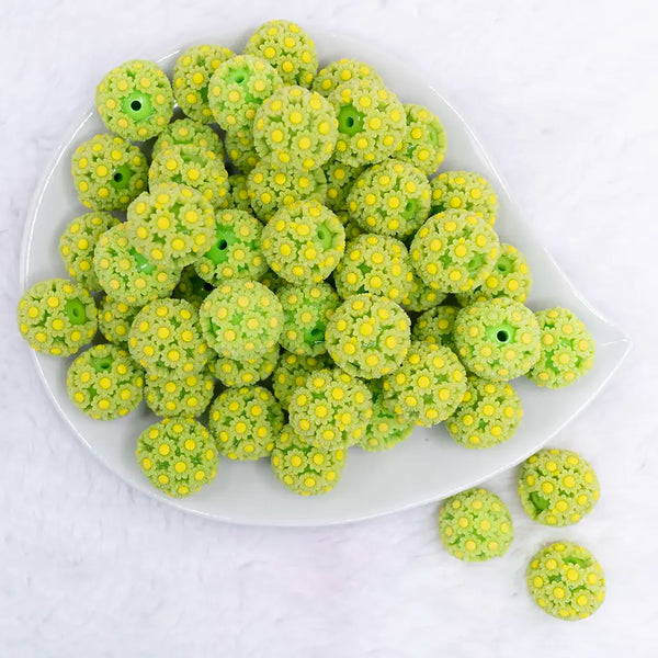 top view of a pile of 19mm Green Daisy Flower luxury bead