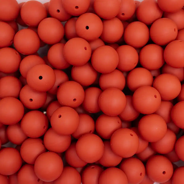 top view of a pile of 19mm Red/Brown Round Silicone Bead