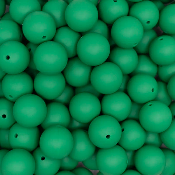 close up view of a pile of 19mm Christmas Green Round Silicone Bead