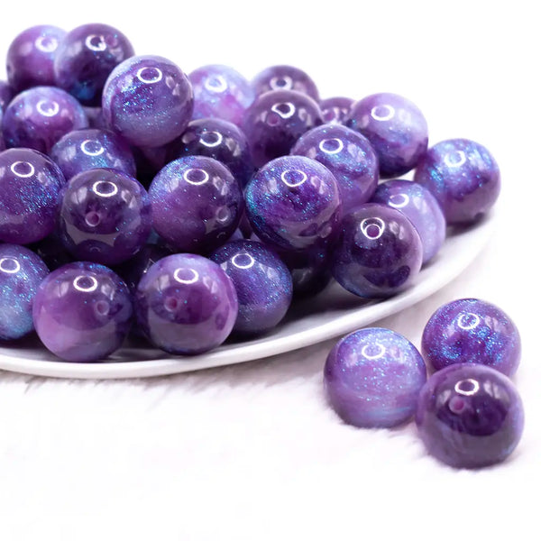 front view of a pile of 20mm Dark Purple Opalescence Bubblegum Bead