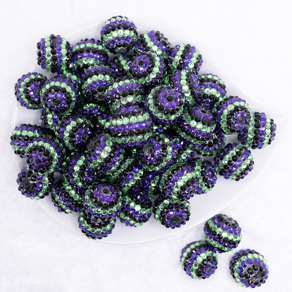 top view of a pile of 20mm Purple and Green Striped Rhinestone Bubblegum Beads