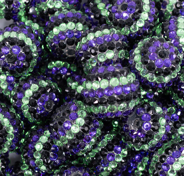 close up view of a pile of 20mm Purple and Green Striped Rhinestone Bubblegum Beads