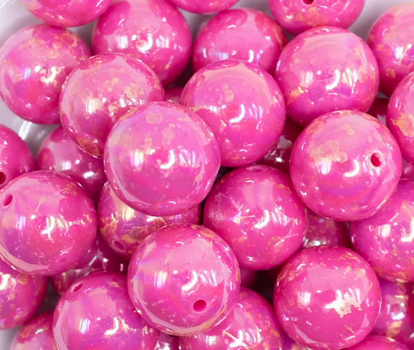 close up view of a pile of 20MM Hot Pink with Gold Foil AB Bubblegum Beads