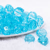 front view of a pile of 20mm Ice Blue Transparent Faceted Bubblegum Beads