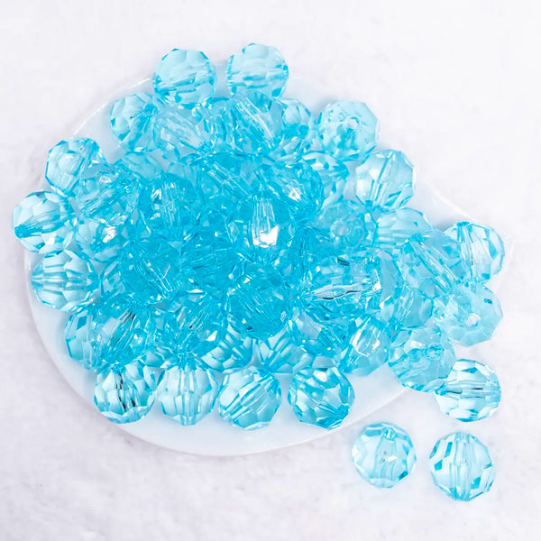 top view of a pile of 20mm Ice Blue Transparent Faceted Bubblegum Beads
