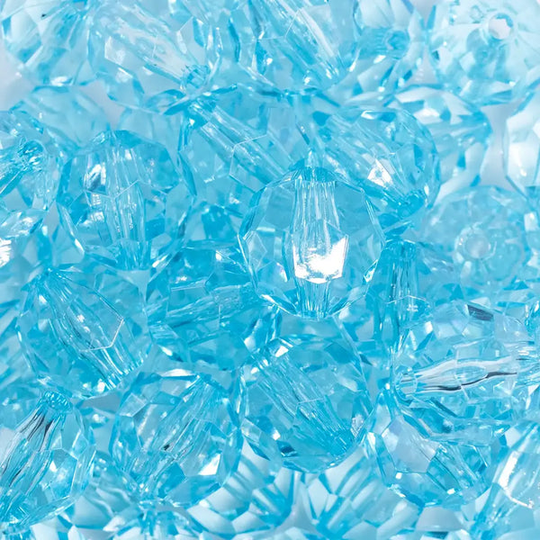 close up view of a pile of 20mm Ice Blue Transparent Faceted Bubblegum Beads