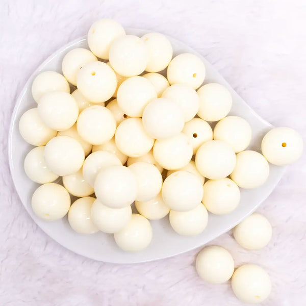 top view of a pile of 20mm Ivory Solid Bubblegum Beads