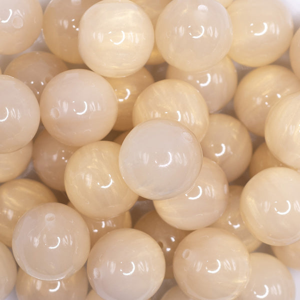 close up view of a pile of 20mm Ivory Luster Bubblegum Beads