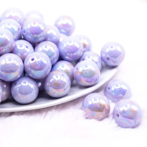 front view of a pile of 20MM Light Purple with Gold Foil Splatter AB Bubblegum Beads