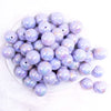 top view of a pile of 20MM Light Purple with Gold Foil Splatter AB Bubblegum Beads