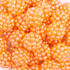 close up view of a pile of 20mm Orange Berry Rhinestone Bubblegum Beads