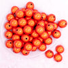 top view of a pile of 20mm Orange Miracle Bubblegum Bead