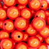 close up view of a pile of 20mm Orange Miracle Bubblegum Bead