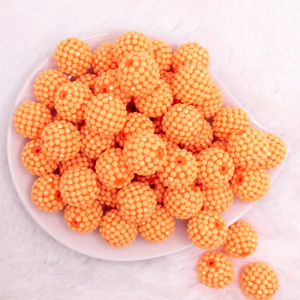 top view of a pile of 20mm Orange on Orange Rhinestone Bubblegum Beads