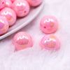 macro view of a pile of 20MM Pink with Gold Foil Splatter AB Bubblegum Beads