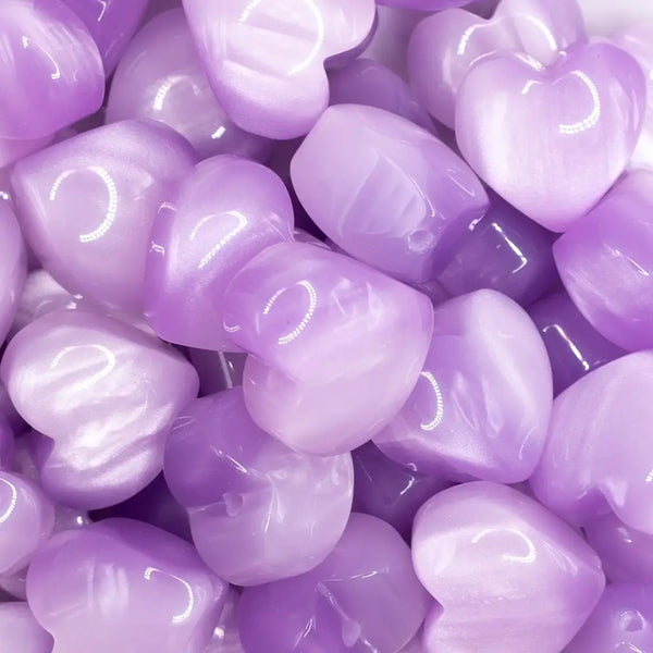 close up view of a pile of 20mm Purple Opal Heart Shaped Acrylic Beads