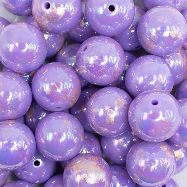 close up view of a pile of 20MM Purple with Gold Foil AB Bubblegum Beads