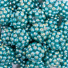 close up view of a pile of 20mm Teal Green Berry Rhinestone Bubblegum Beads