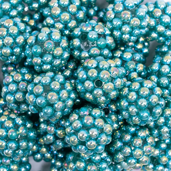 close up view of a pile of 20mm Teal Green Berry Rhinestone Bubblegum Beads