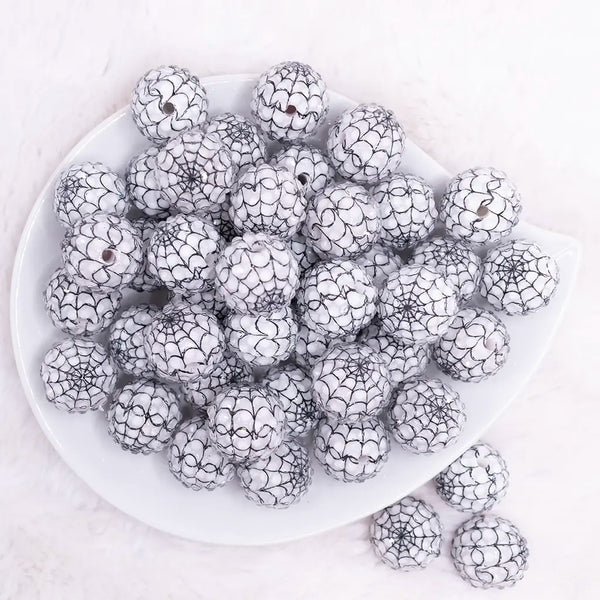 top view of a pile of 20mm White with Black Spider Web Rhinestone Bubblegum Beads