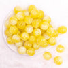 top view of a pile of 20mm Yellow Opalescence Bubblegum Bead