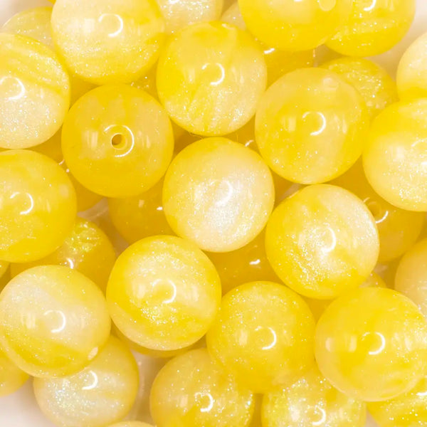 close up view of a pile of 20mm Yellow Opalescence Bubblegum Bead