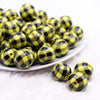 front view of a pile of 20mm Yellow with Black Plaid Print Acrylic Bubblegum Beads