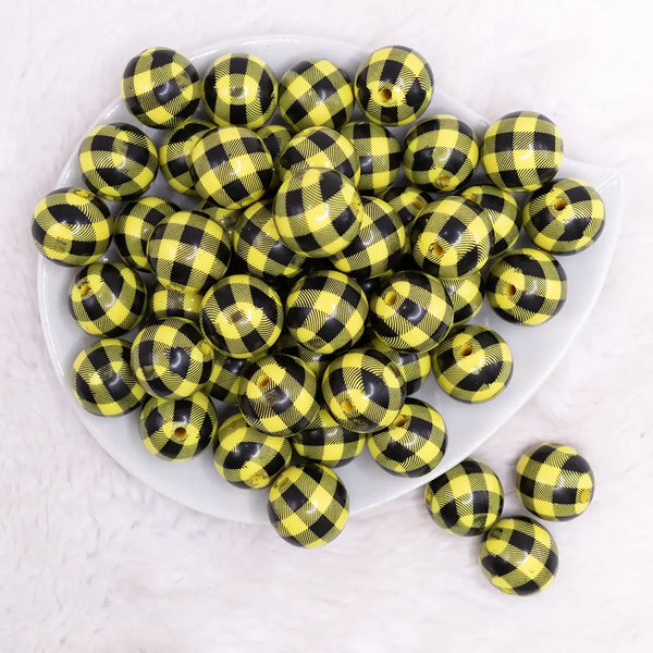 top view of a pile of 20mm Yellow with Black Plaid Print Acrylic Bubblegum Beads