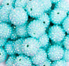 close up view of a pile of 20mm Aqua Blue Rhinestone AB Bubblegum Beads