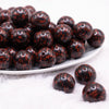 front view of a pile of 20mm Brown & Black Leopard Animal Print Bubblegum Beads
